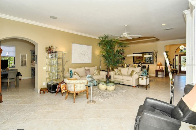 living room featuring crown molding, ceiling fan, plenty of natural light, and light tile patterned floors