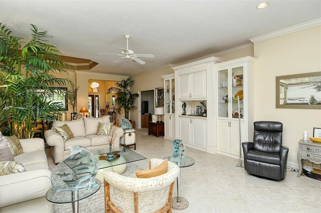 tiled living room featuring crown molding and ceiling fan