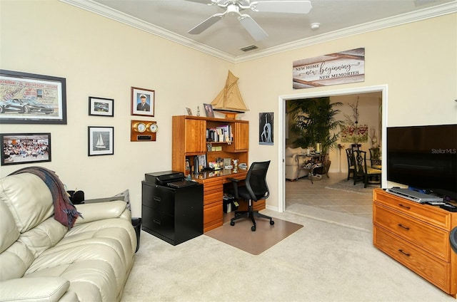 carpeted home office featuring ceiling fan and ornamental molding