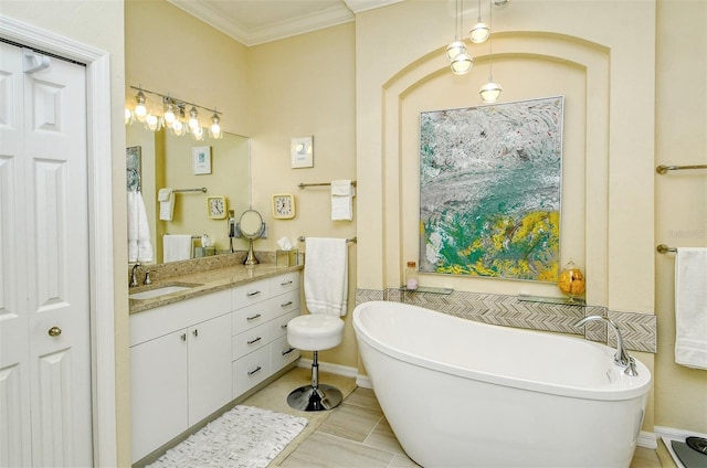 bathroom with vanity, a tub to relax in, tile patterned floors, and ornamental molding