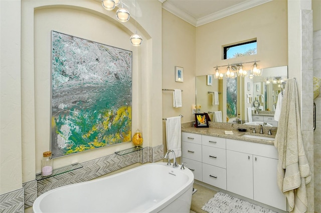 bathroom featuring ornamental molding, a bath, and vanity