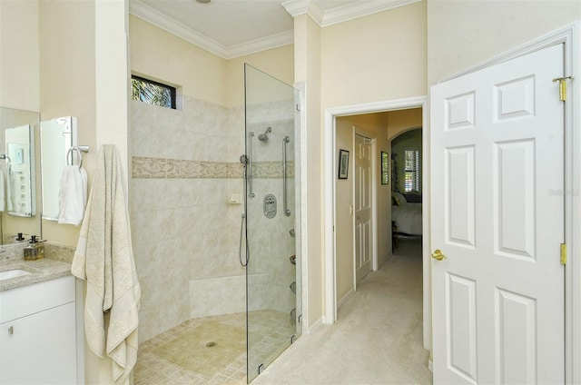 bathroom with an enclosed shower, ornamental molding, and vanity