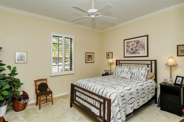 bedroom with crown molding, light colored carpet, and ceiling fan