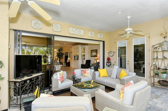 living room featuring ceiling fan