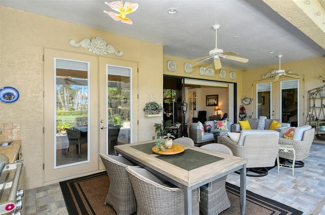 dining area featuring french doors and ceiling fan