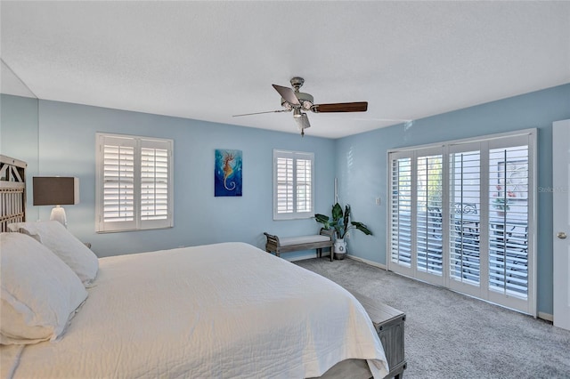 bedroom with carpet flooring, access to outside, and ceiling fan