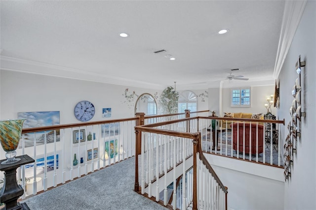 hallway with crown molding and carpet floors