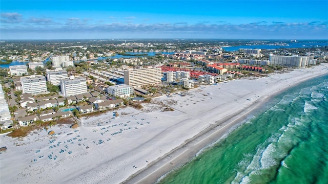 aerial view with a water view and a view of the beach