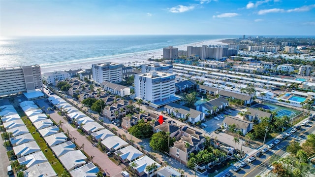 drone / aerial view with a water view and a view of the beach