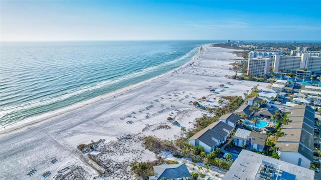 aerial view featuring a view of the beach and a water view