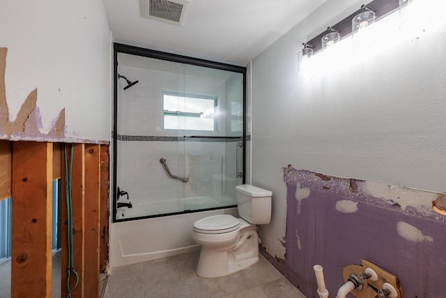 bathroom with enclosed tub / shower combo, tile patterned flooring, visible vents, and toilet