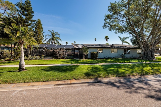 ranch-style home with a front yard