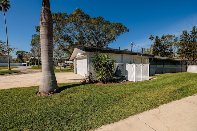 view of side of property featuring a yard