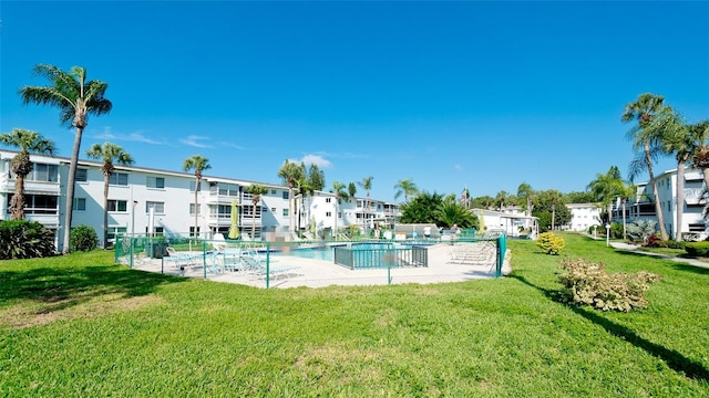 view of pool featuring a yard