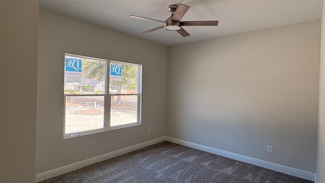 carpeted empty room featuring ceiling fan