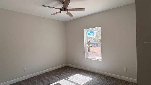 carpeted empty room featuring ceiling fan