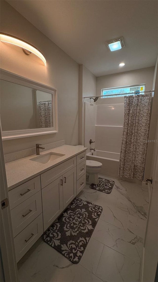 full bathroom with vanity, toilet, and shower / bath combo