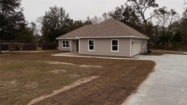 back of house featuring cooling unit