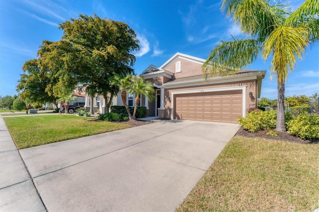 view of front of home with a garage and a front yard