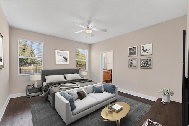 bedroom with dark hardwood / wood-style floors, ceiling fan, and ensuite bathroom