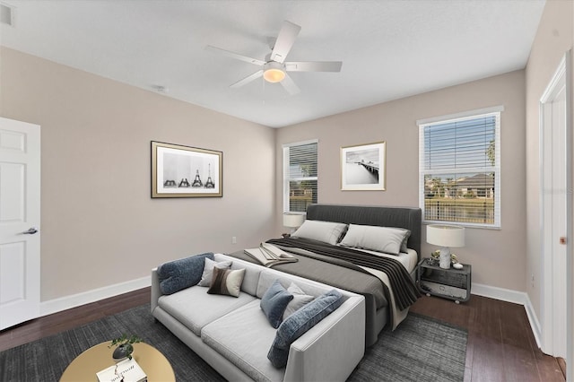 bedroom featuring dark wood-type flooring and ceiling fan