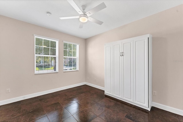 unfurnished bedroom with ceiling fan