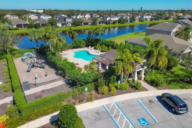 birds eye view of property with a water view