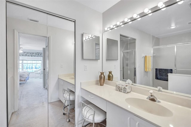 bathroom with vanity and walk in shower