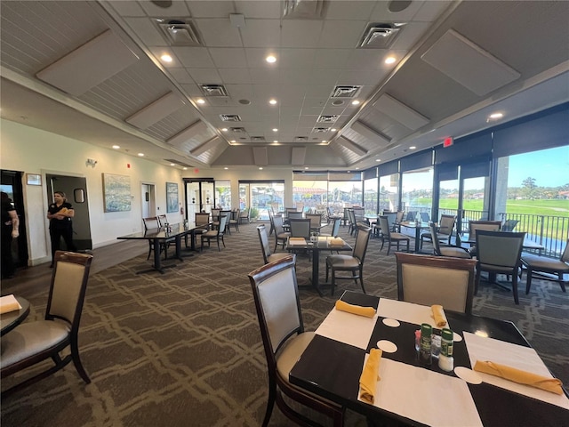 carpeted dining area with a wealth of natural light