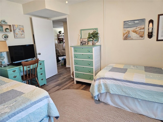 bedroom featuring wood finished floors