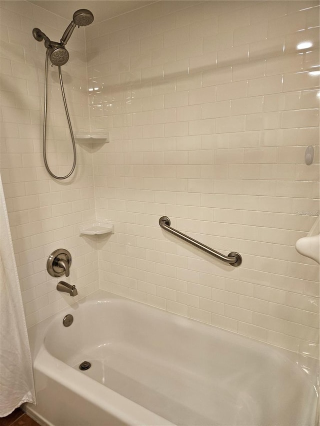 full bathroom with shower / bath combo