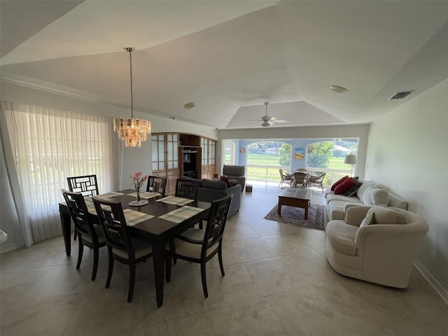 dining room featuring vaulted ceiling and ceiling fan with notable chandelier