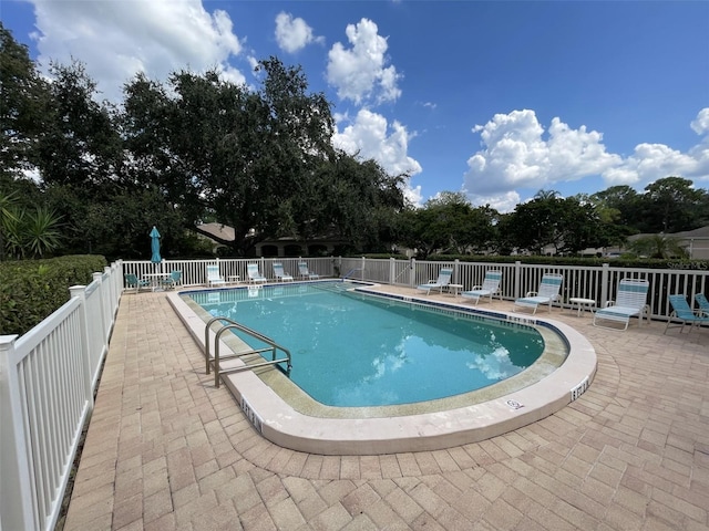 view of swimming pool featuring a patio