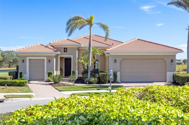 mediterranean / spanish house featuring a garage