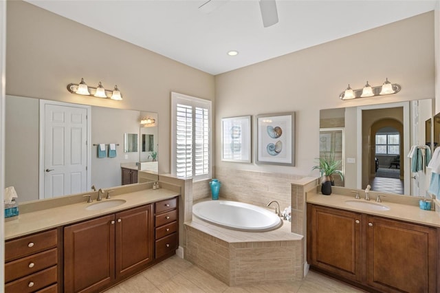 bathroom with vanity, tile patterned flooring, independent shower and bath, and ceiling fan