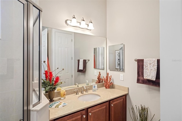 bathroom featuring vanity and an enclosed shower