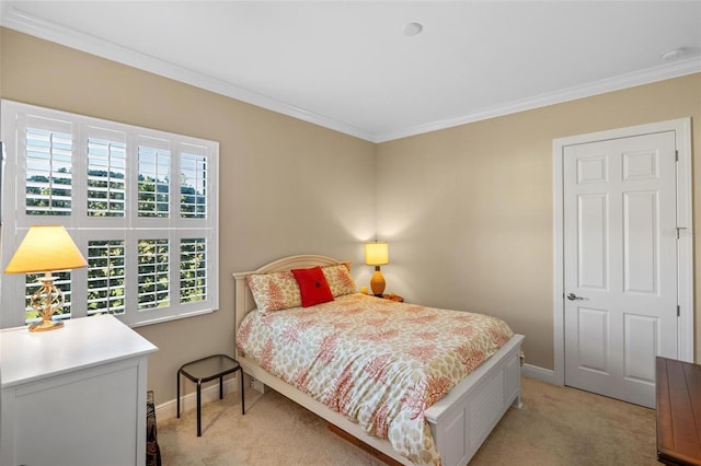 carpeted bedroom featuring crown molding