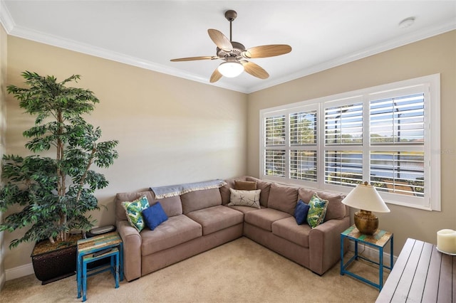 carpeted living room with ornamental molding and ceiling fan