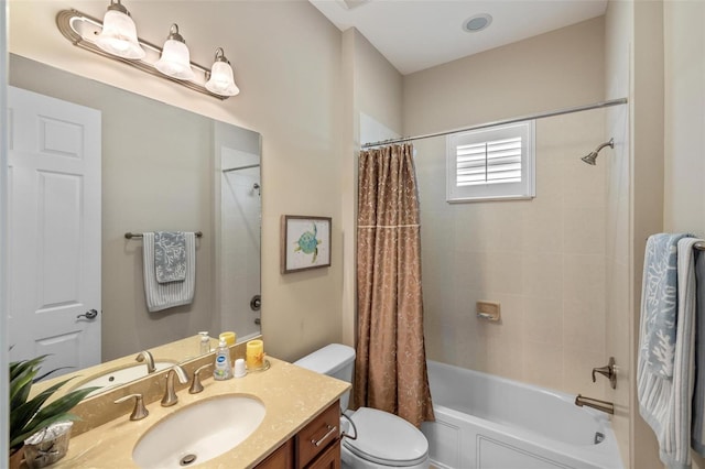 full bathroom featuring shower / tub combo with curtain, vanity, and toilet