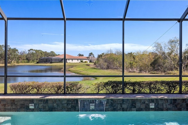 view of swimming pool with a lanai and a water view