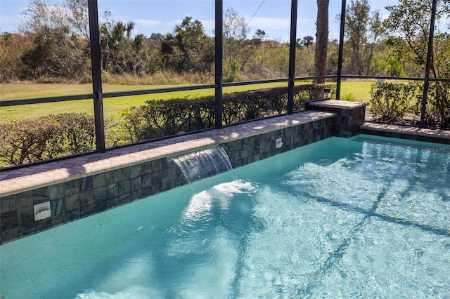 view of swimming pool with pool water feature