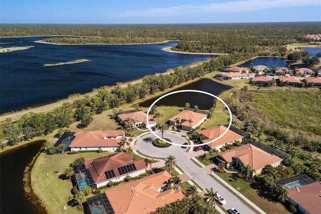 birds eye view of property with a water view