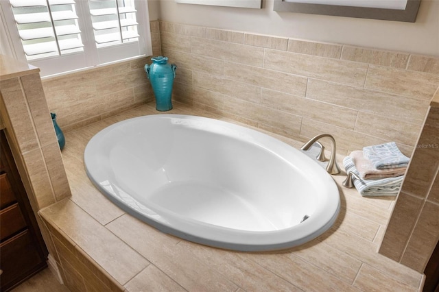 bathroom with tiled tub