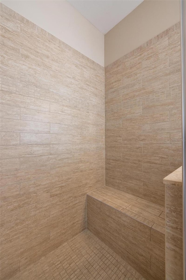 bathroom featuring tiled shower