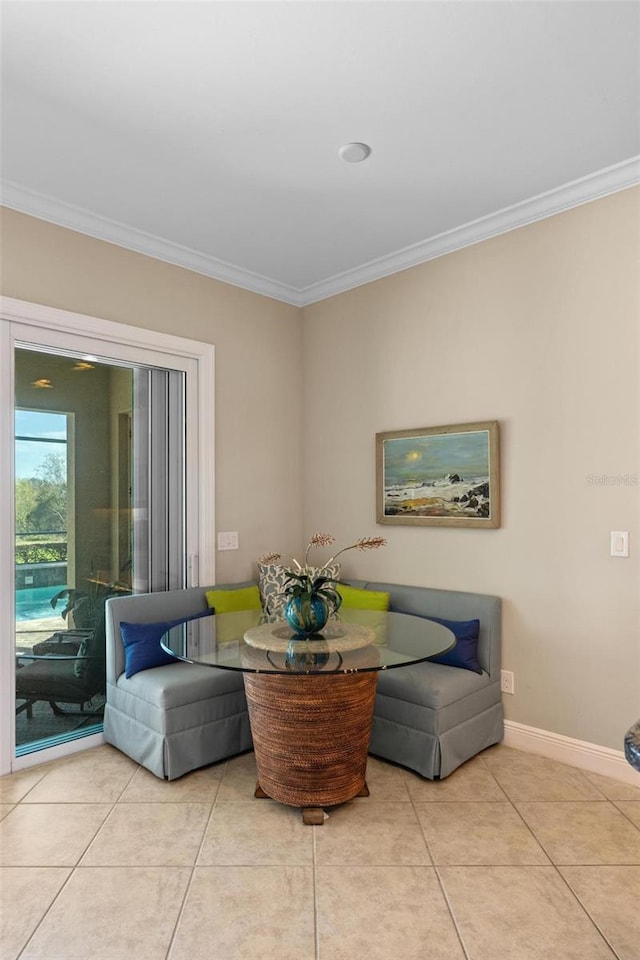 dining space with ornamental molding, light tile patterned floors, and breakfast area