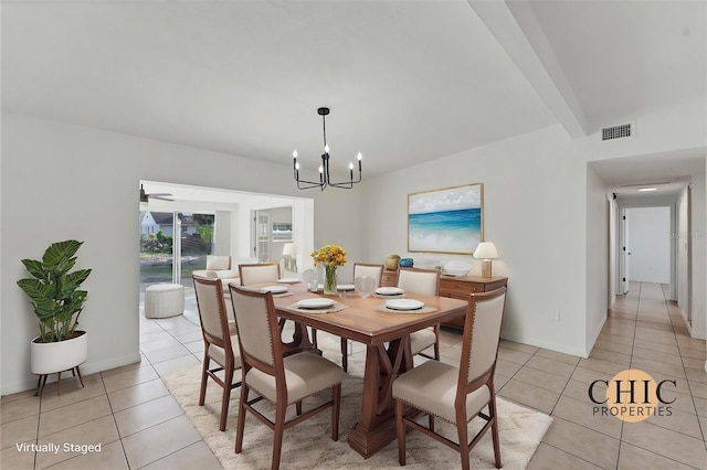 tiled dining space with beamed ceiling and a chandelier