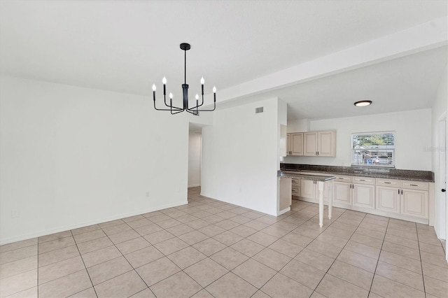 kitchen featuring pendant lighting, an inviting chandelier, and light tile patterned floors