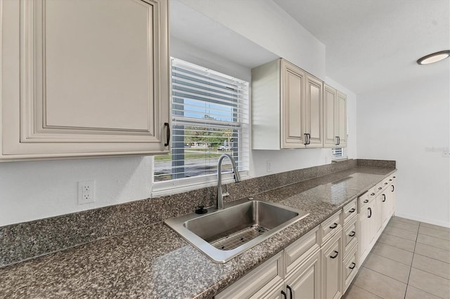 kitchen with light tile patterned flooring and sink