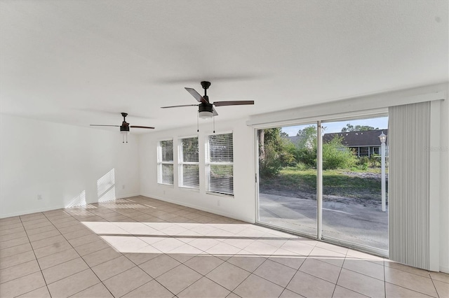 unfurnished room featuring light tile patterned floors