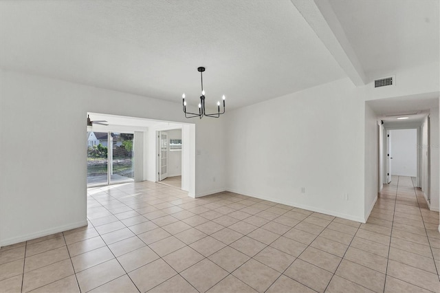 unfurnished dining area with beamed ceiling, ceiling fan with notable chandelier, and light tile patterned floors